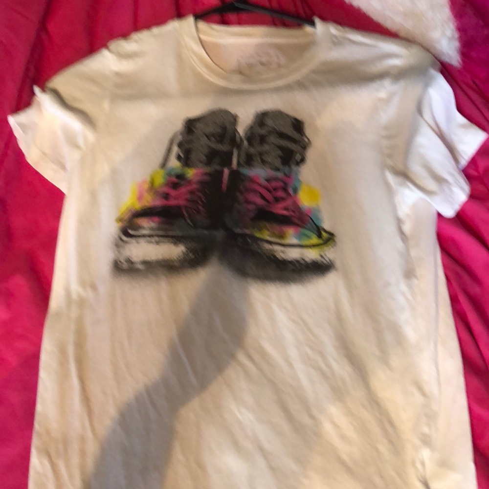 White shirt with shoes on it